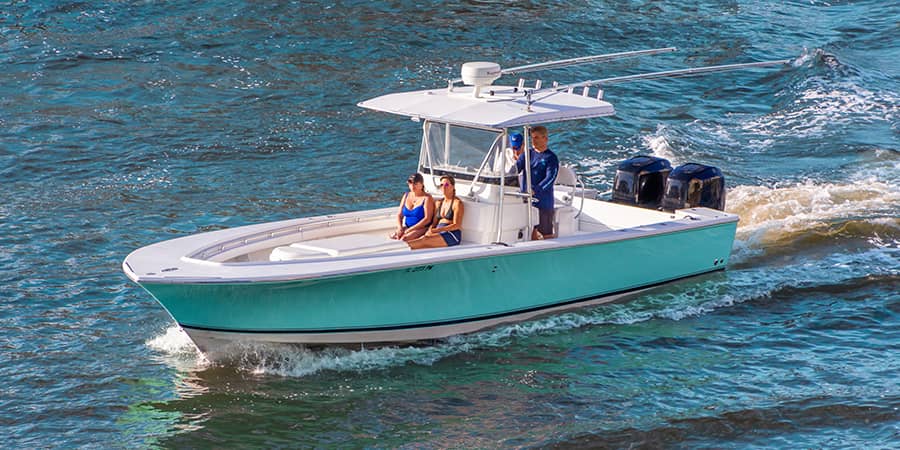 Overhead view of two couples riding in an open fisherman boat.