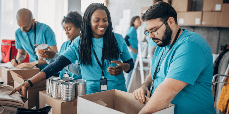 A group of volunteers packaging food items.