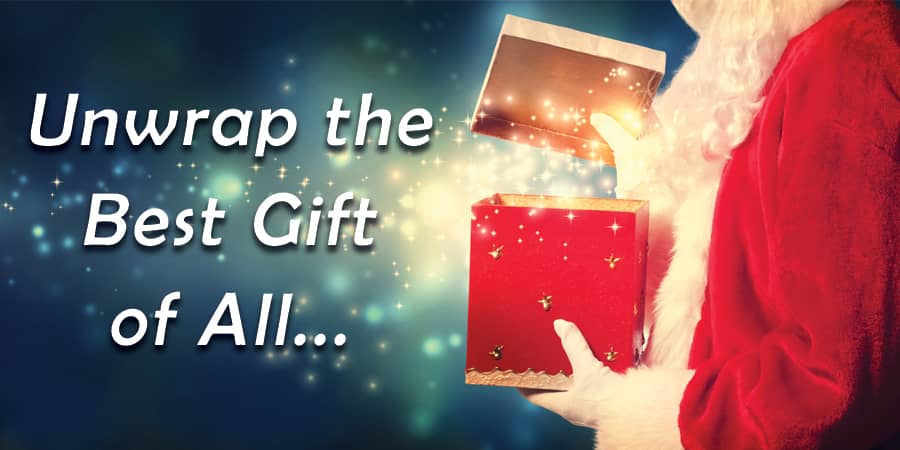 Santa Claus opening a magical box. To the left, the words: Unwrap the best gift of all.