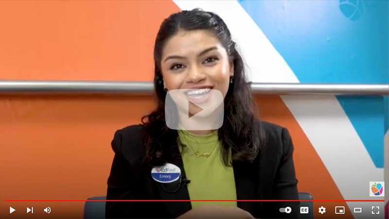 Video thumbnail showing Emory speaking.