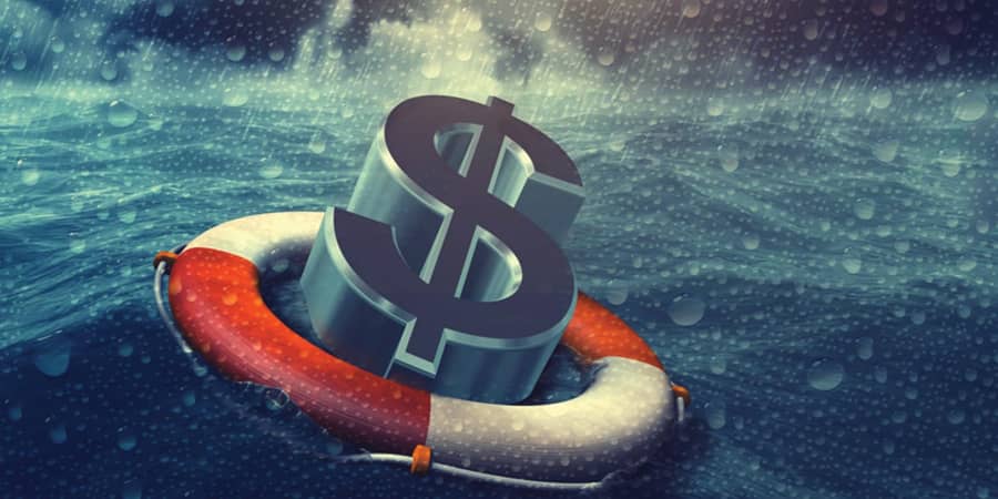 A US dollar symbol inside a ring buoy while floating in the ocean during a storm.