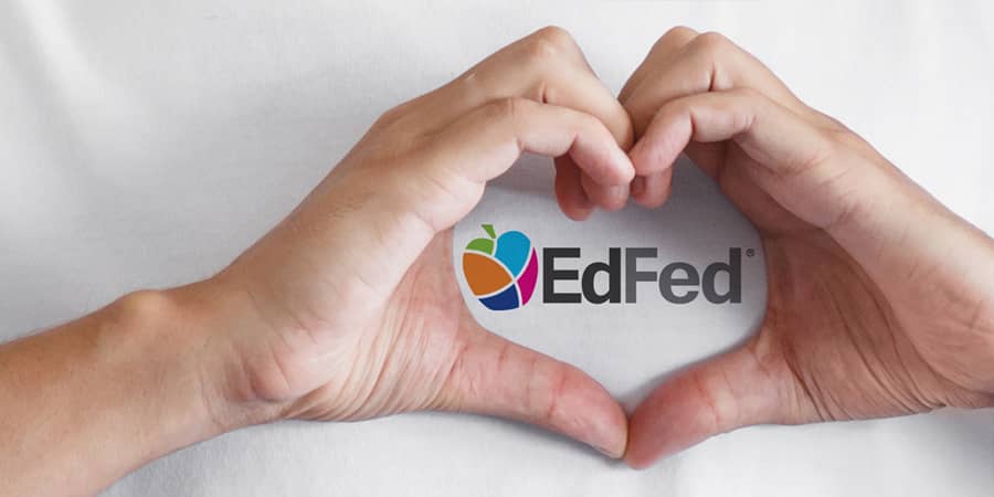 Two hands in the shape of a heart. At the center, the EdFed logo.