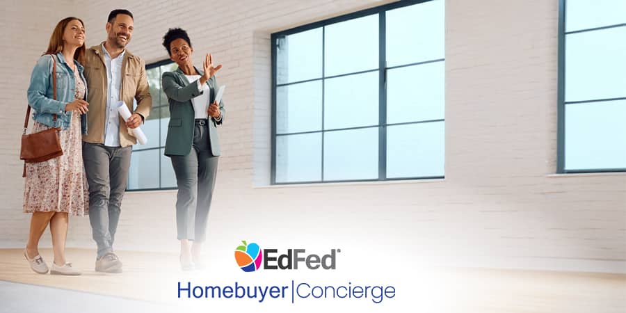 A concierge directing a couple through a home.